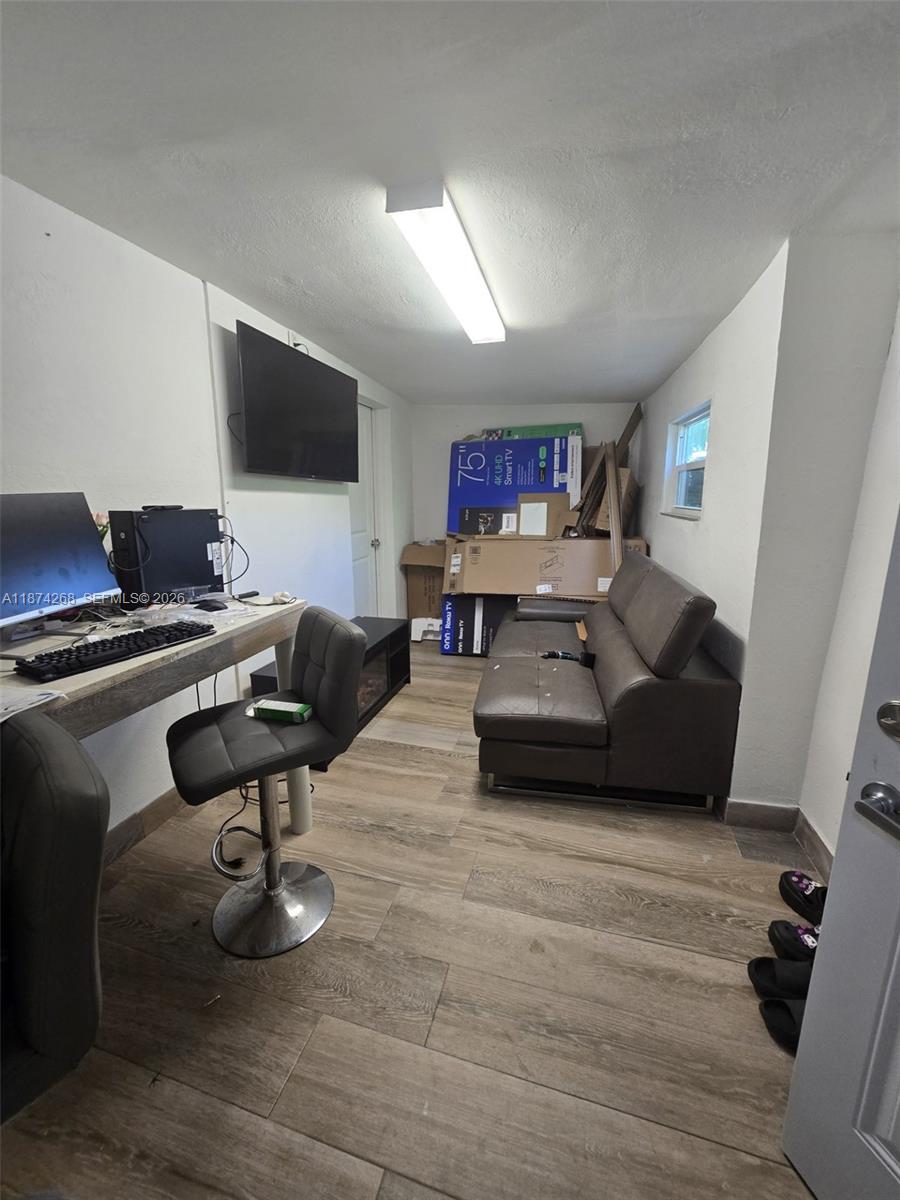 110 West 53rd Street Hialeah, FL 33012 - Photo 19 of 19 a living room with furniture and a flat screen tv