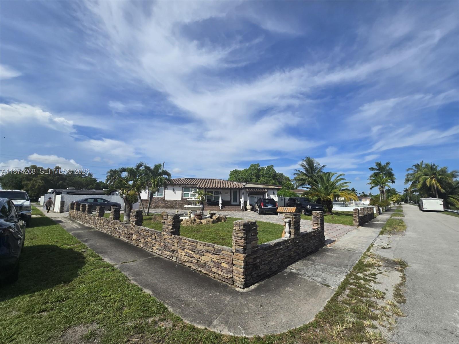 110 West 53rd Street Hialeah, FL 33012 - Photo 3 of 19 a view of a swimming pool with a patio