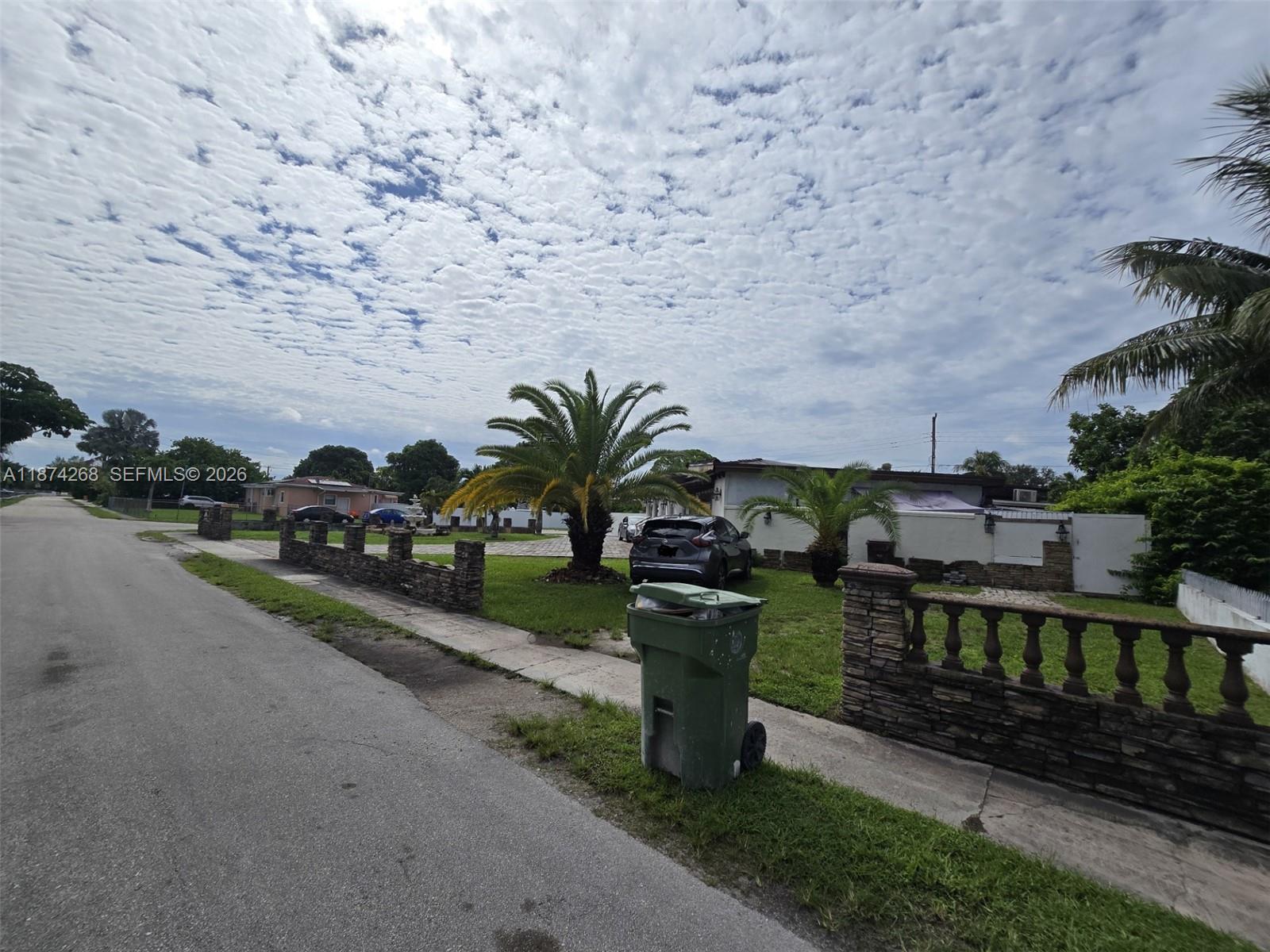 110 West 53rd Street Hialeah, FL 33012 - Photo 4 of 19 a view of a chair and table in the garden