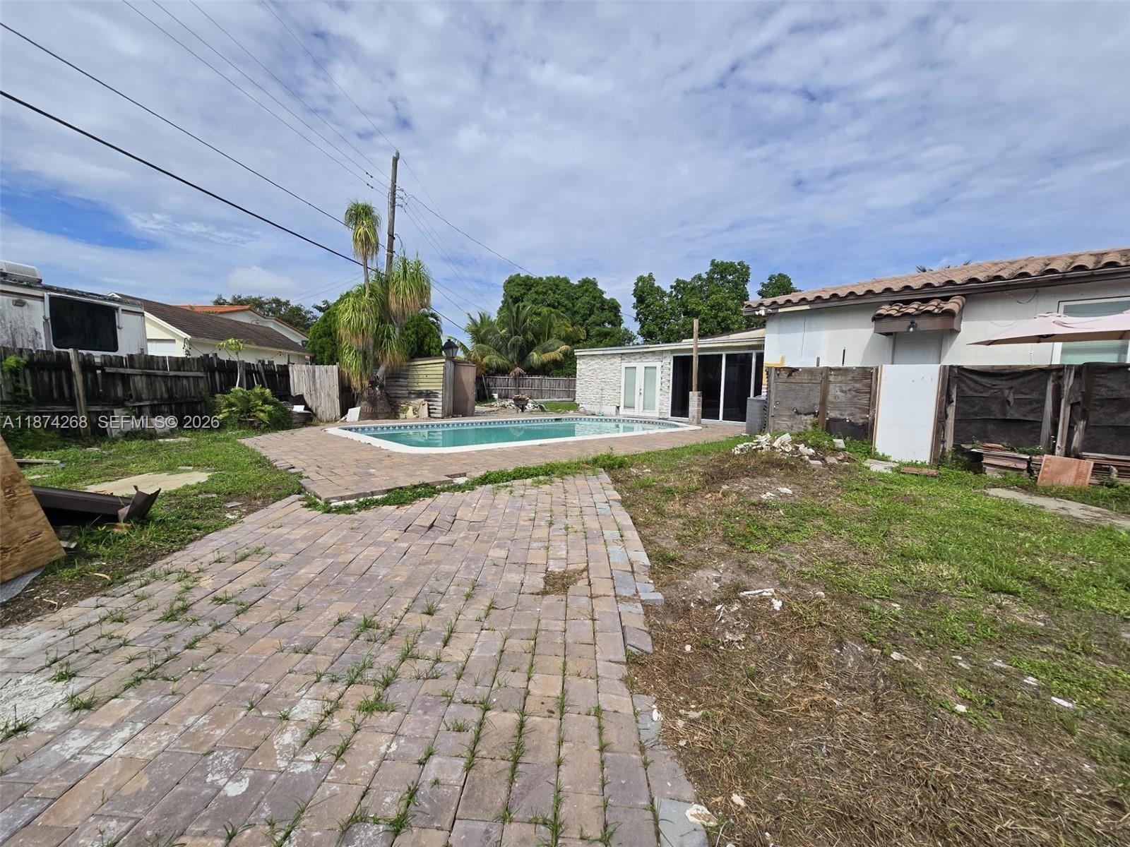 110 West 53rd Street Hialeah, FL 33012 - Photo 5 of 19 a view of a house with a yard