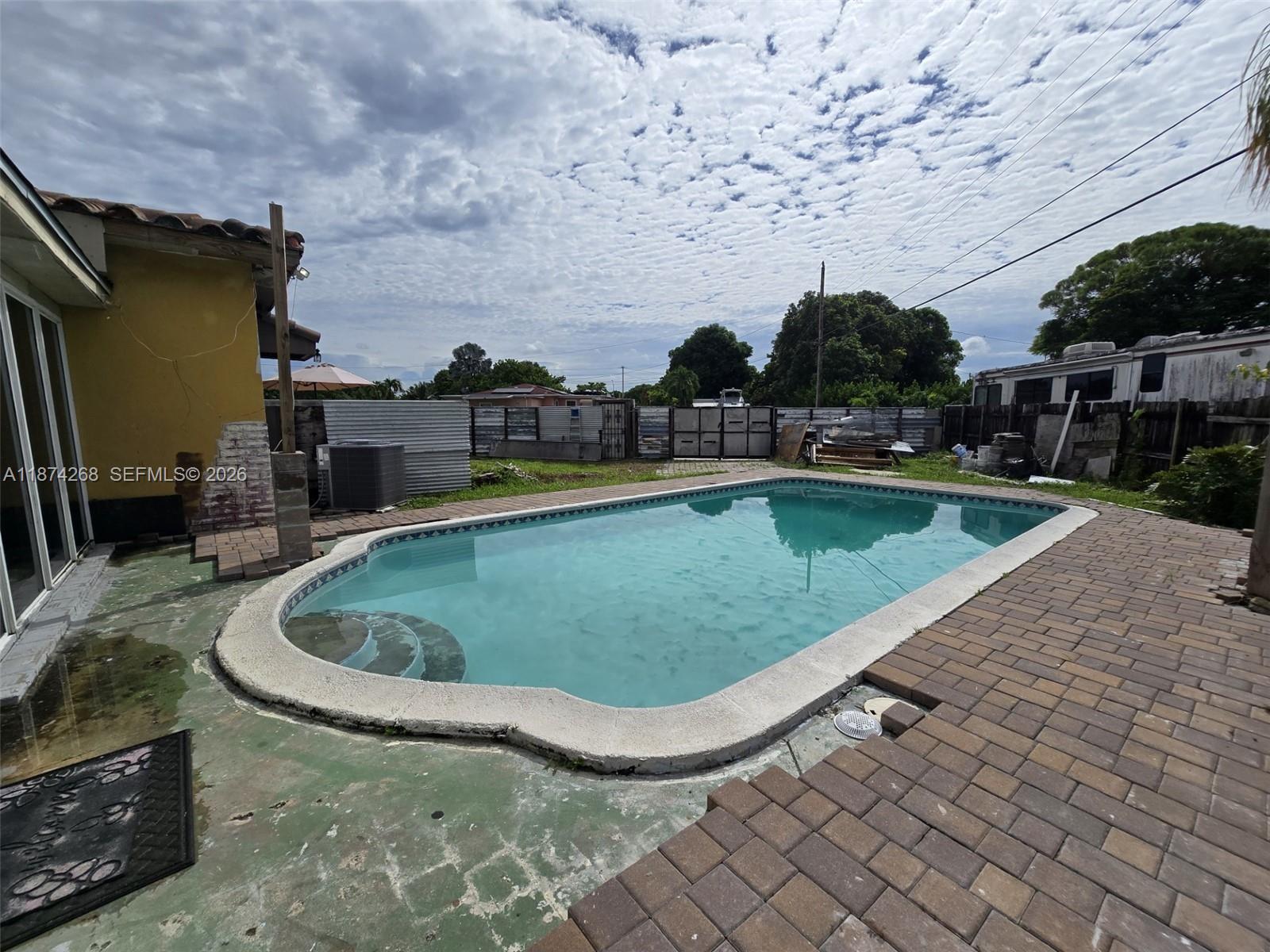 110 West 53rd Street Hialeah, FL 33012 - Photo 6 of 19 a view of a swimming pool with a patio