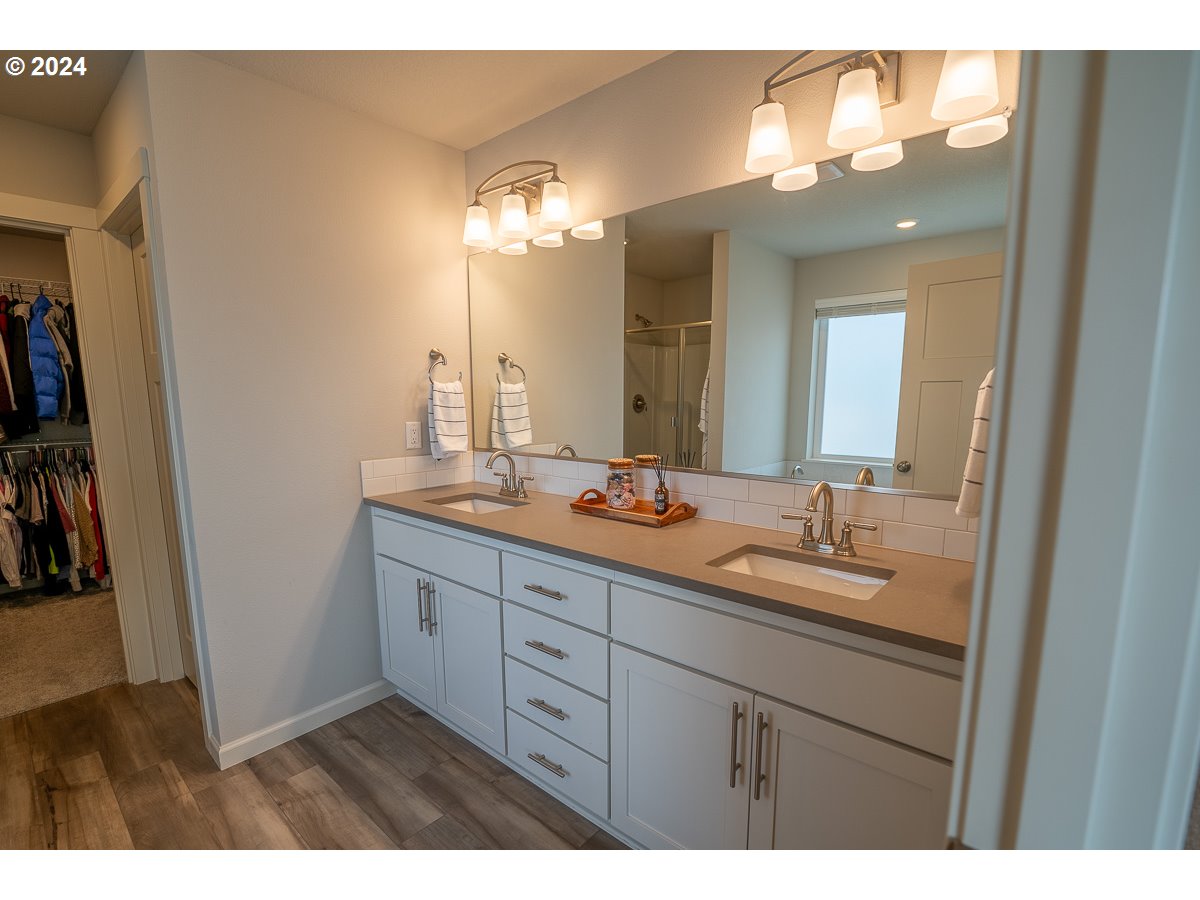 38459 Maple Street Sandy, OR 97055 - Photo 11 of 20 a bathroom with a double vanity sink and a mirror