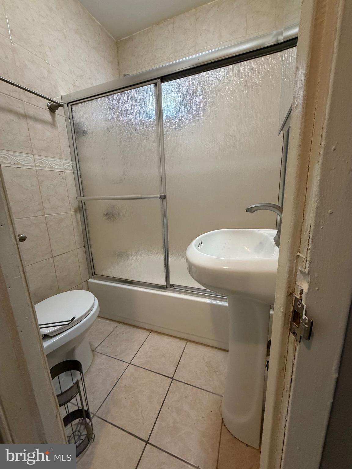 3310 E Street Philadelphia, PA 19134 - Photo 7 of 14 a bathroom with a toilet and a shower