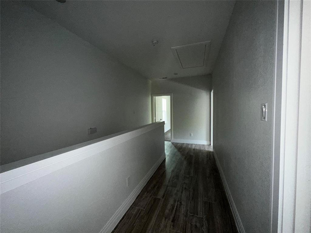 4435 Franklin Street Lancaster, TX 75134 - Photo 14 of 17 a view of a hallway with wooden floor