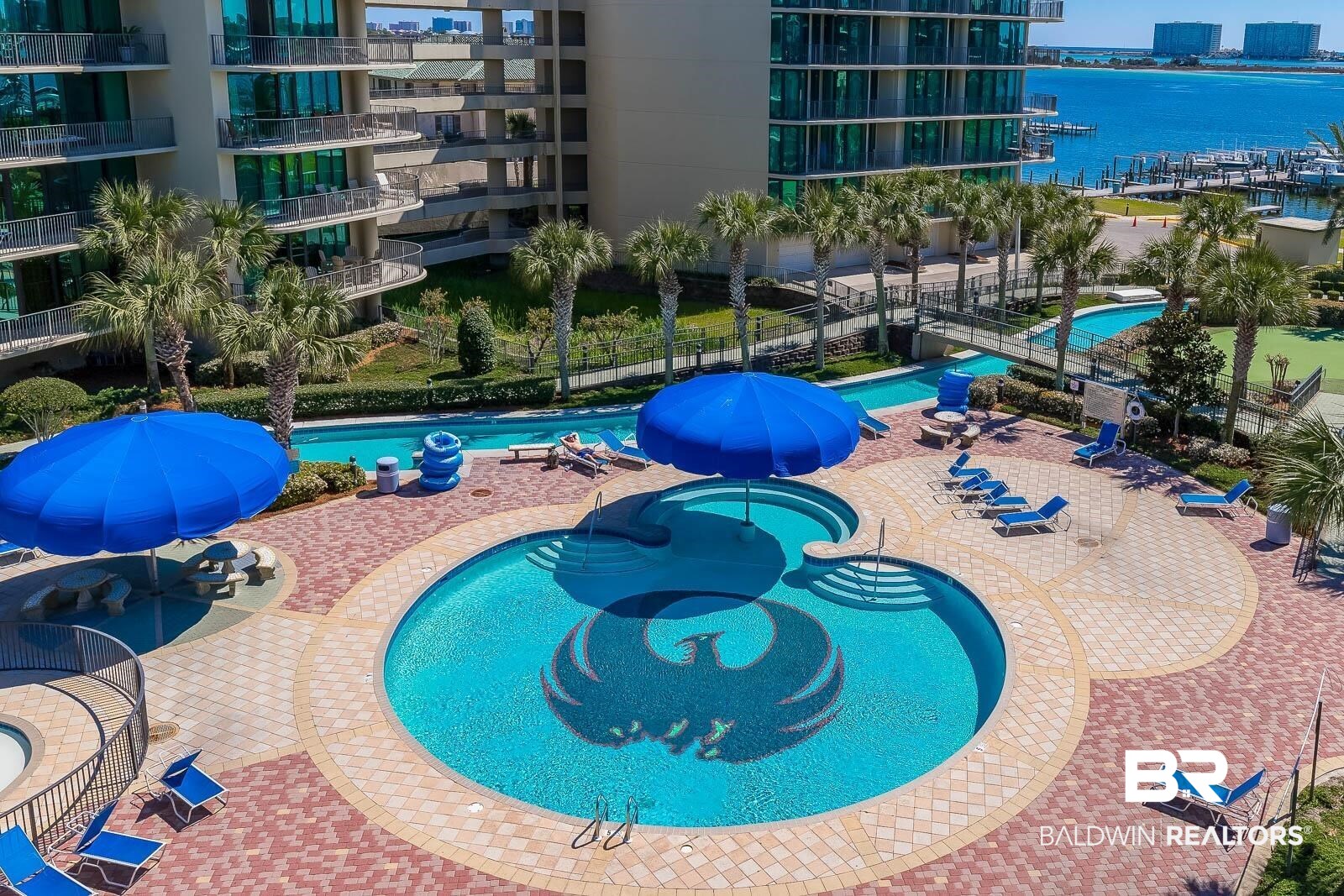 27580 Canal Road, Unit 1429 Orange Beach, AL 36561 - Photo 34 of 45 Community pool featuring a water view, a community hot tub, and a patio