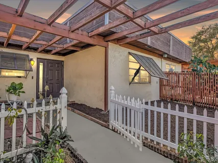 a view of porch with wooden stairs and furniture