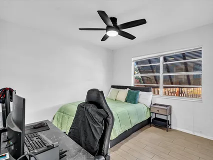 a bed room with a bed and a window