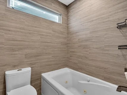 a bathroom with a toilet and a sink