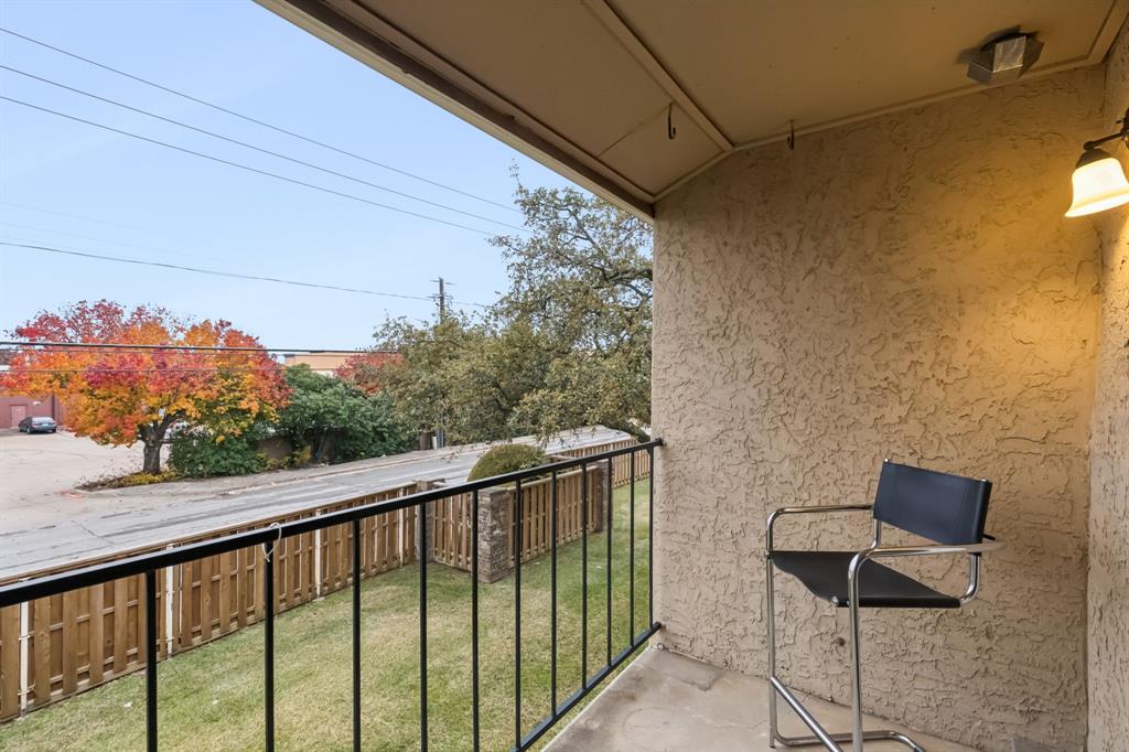 4748 Old Bent Tree Lane, Unit 1808 Dallas, TX 75287 - Photo 18 of 28 a balcony with a couple of chairs