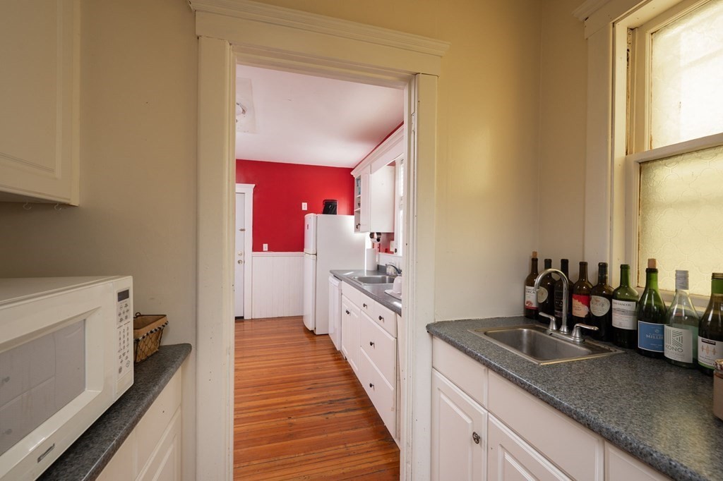 6 Edwin Street Brookline, MA 02445 - Photo 13 of 33 a kitchen with sink and cabinets