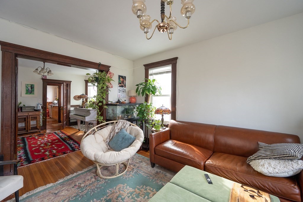 6 Edwin Street Brookline, MA 02445 - Photo 21 of 33 a living room with furniture and a large window