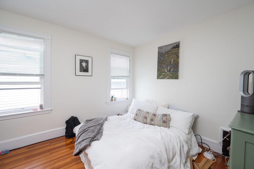 6 Edwin Street Brookline, MA 02445 - Photo 29 of 33 a bedroom with a bed and a window