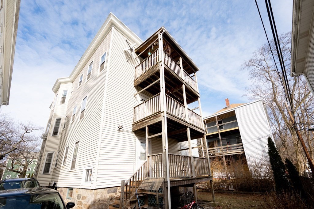 6 Edwin Street Brookline, MA 02445 - Photo 32 of 33 a front view of a house with a yard