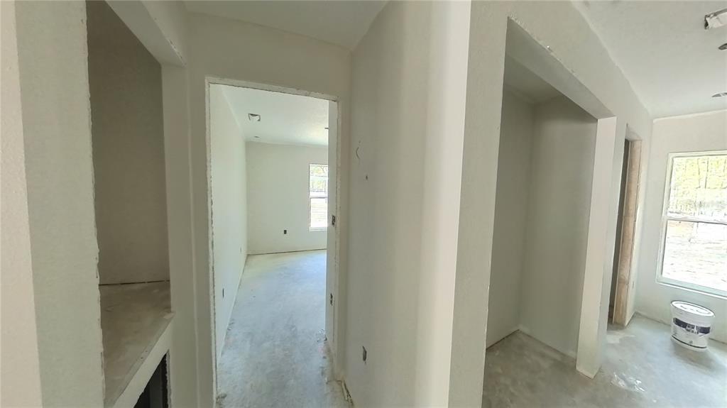 3292 East Porter Street Inverness, FL 34453 - Photo 22 of 34 a view of a bathroom from a hallway