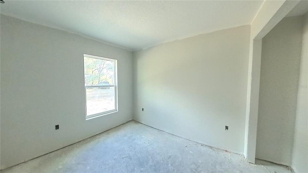 3292 East Porter Street Inverness, FL 34453 - Photo 23 of 34 an empty room with a window