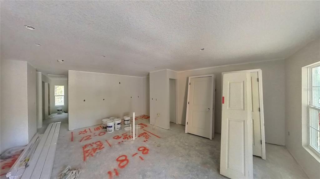 3292 East Porter Street Inverness, FL 34453 - Photo 9 of 34 a very nice looking bedroom with a bed