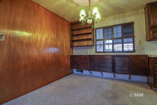 251 West Perdew Avenue Ridgecrest, CA 93555 - Photo 6 of 35 wooden floor in an empty room with a window