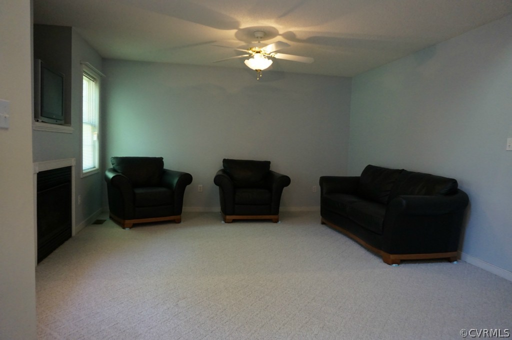 5520 Takach Road Prince George, VA 23875 - Photo 11 of 24 a living room with furniture and a ceiling fan