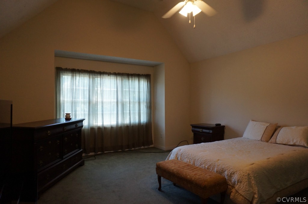 5520 Takach Road Prince George, VA 23875 - Photo 16 of 24 a bedroom with a bed and a chandelier