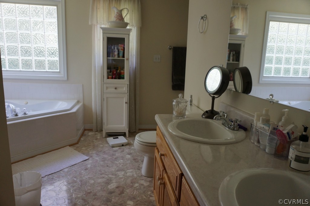 5520 Takach Road Prince George, VA 23875 - Photo 18 of 24 a bathroom with a sink and a bathtub