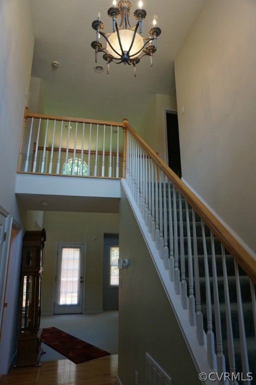 5520 Takach Road Prince George, VA 23875 - Photo 7 of 24 a view of staircase with railing and a chandelier