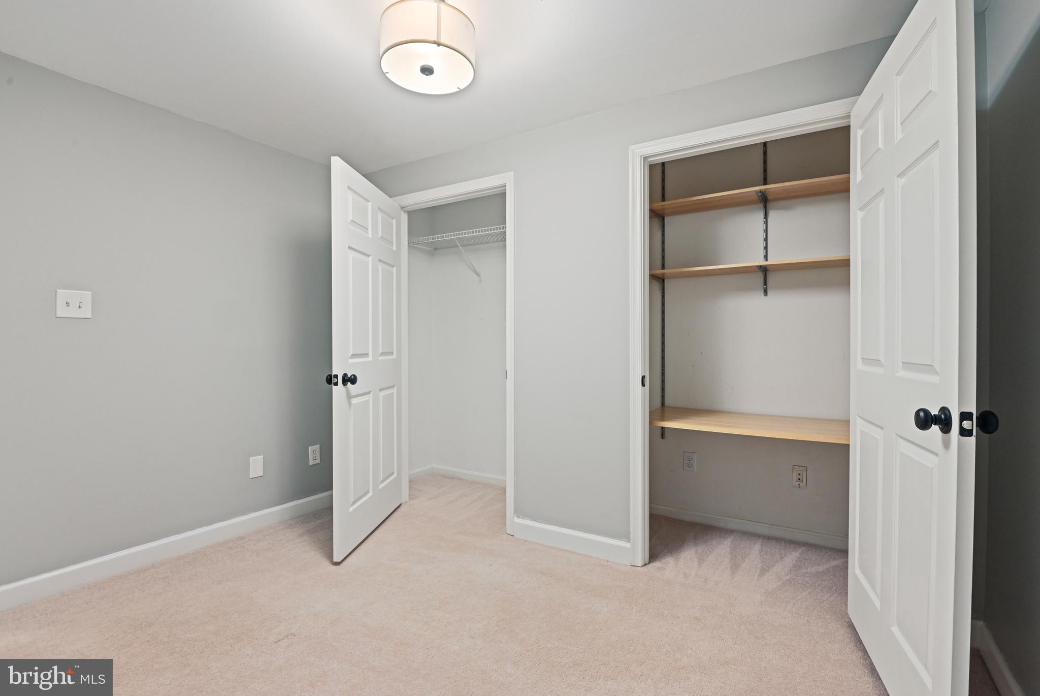 1271 Weatherstone Court Reston, VA 20194 - Photo 36 of 43 an empty room with closet and windows