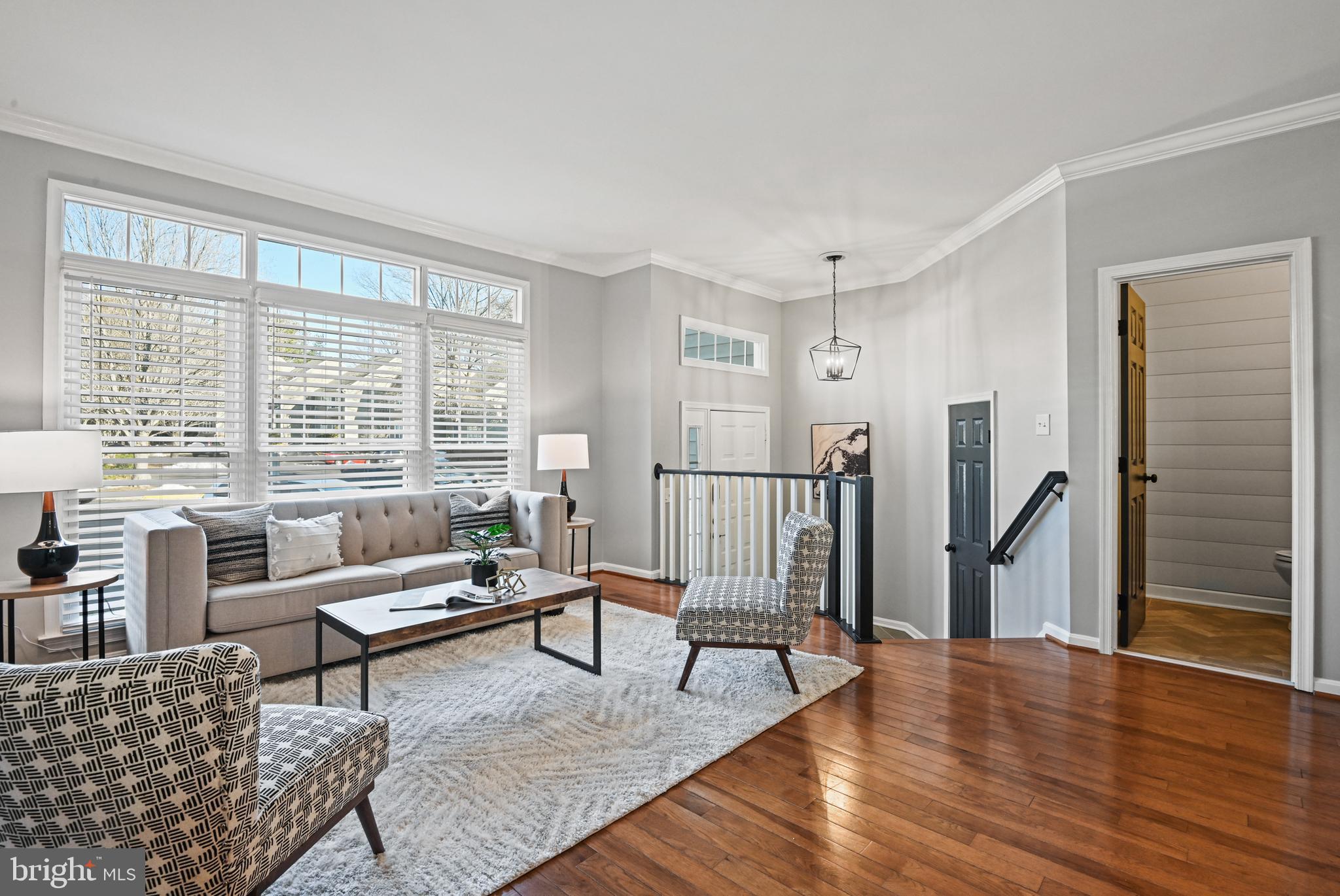 1271 Weatherstone Court Reston, VA 20194 - Photo 6 of 43 a living room with furniture and a large window