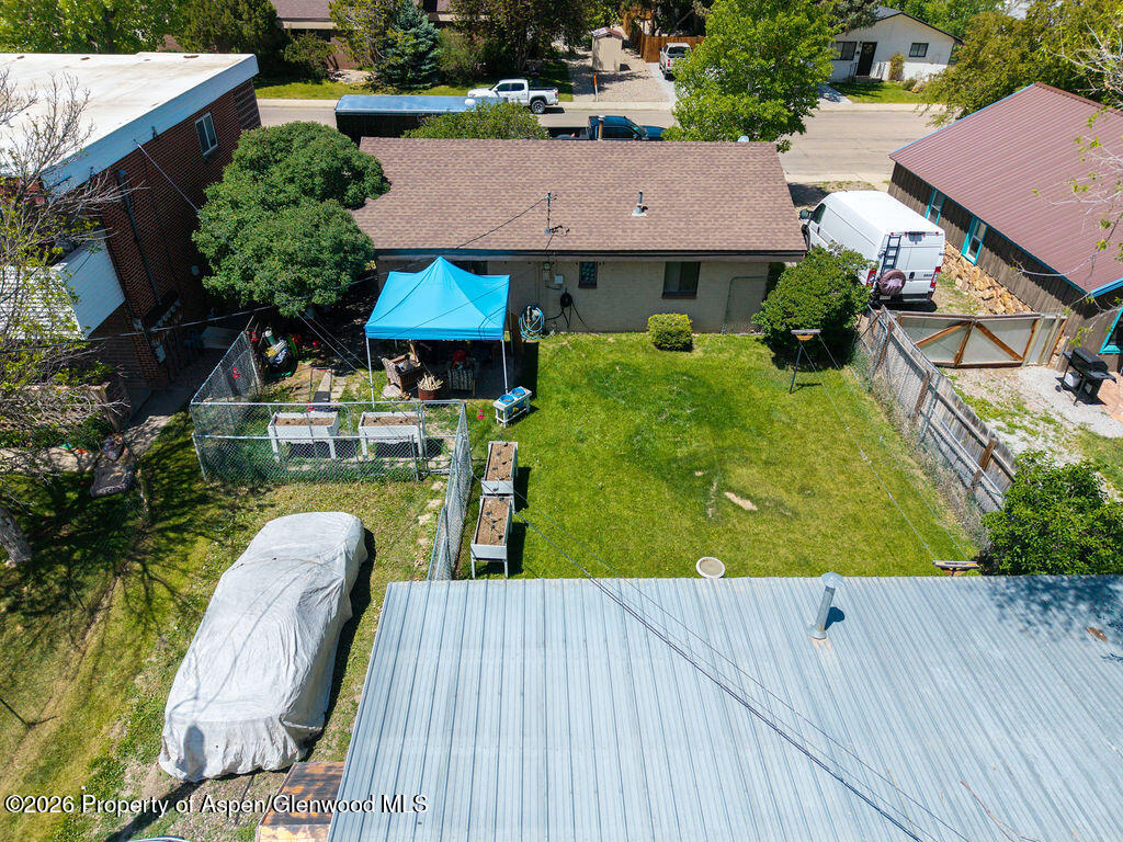 625 Russell Street Craig, CO 81625 - Photo 8 of 35 an aerial view of a house with a swimming pool patio and outdoor seating