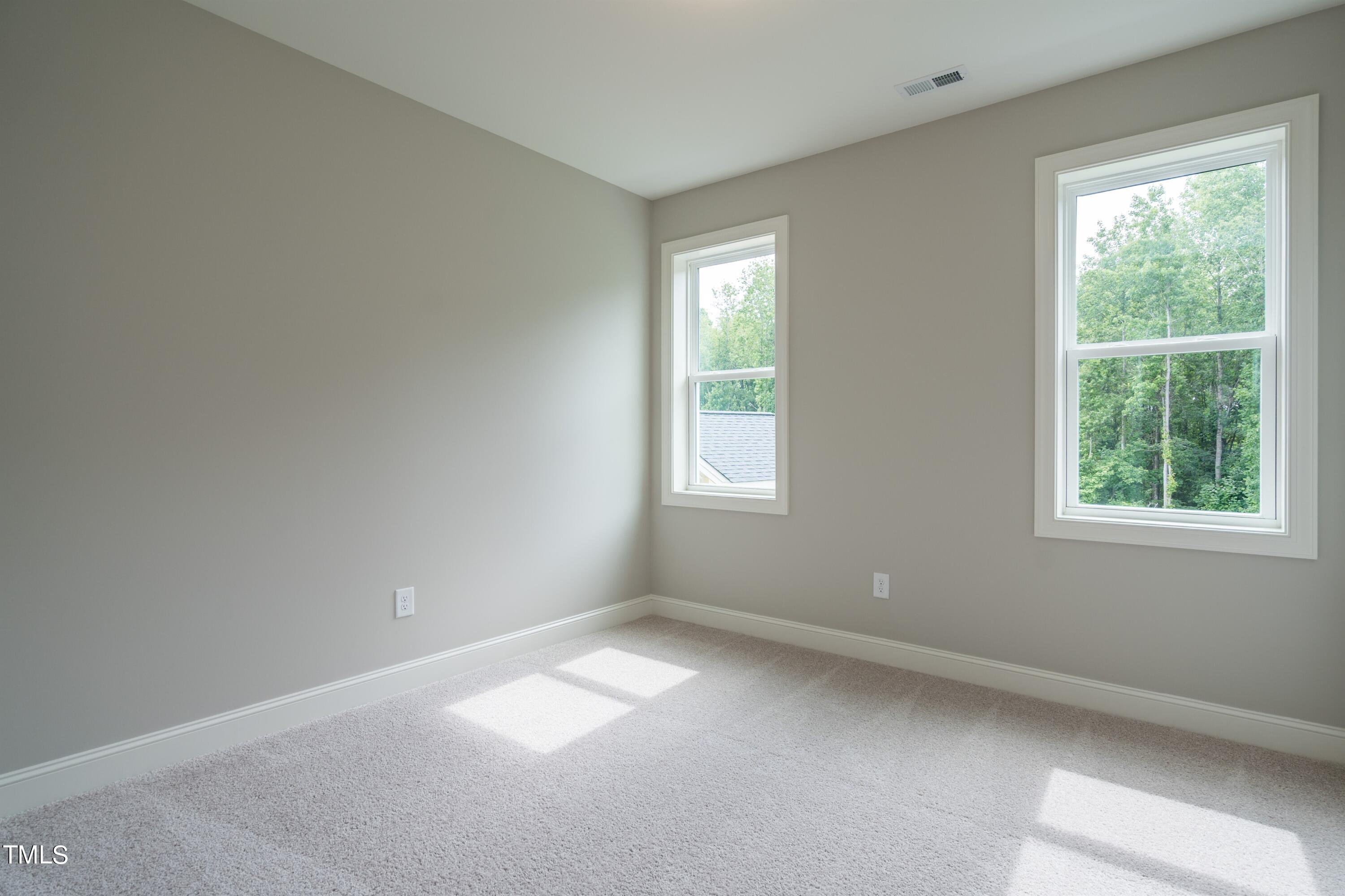6020 Scalybark Road Durham, NC 27712 - Photo 19 of 29 an empty room with a window
