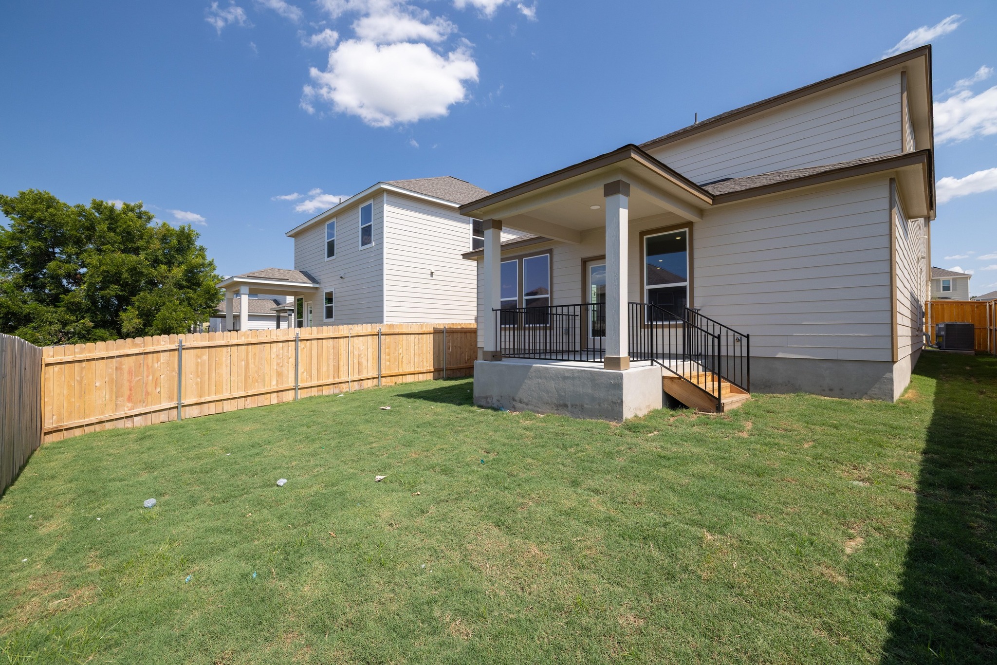 260 Feathers Street Jarrell, TX 76537 - Photo 30 of 34 a view of a house with backyard and porch