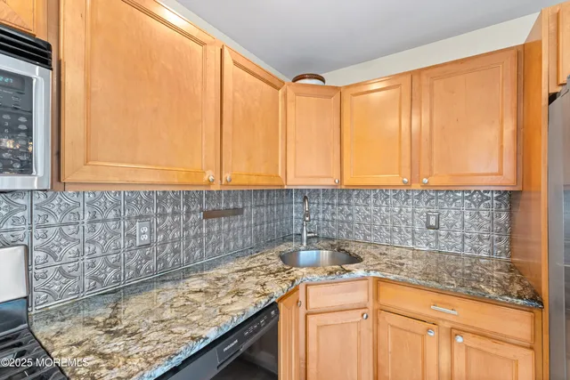 a kitchen with a sink and a window