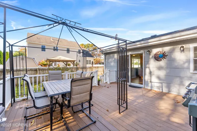 a patio with a patio table and chairs