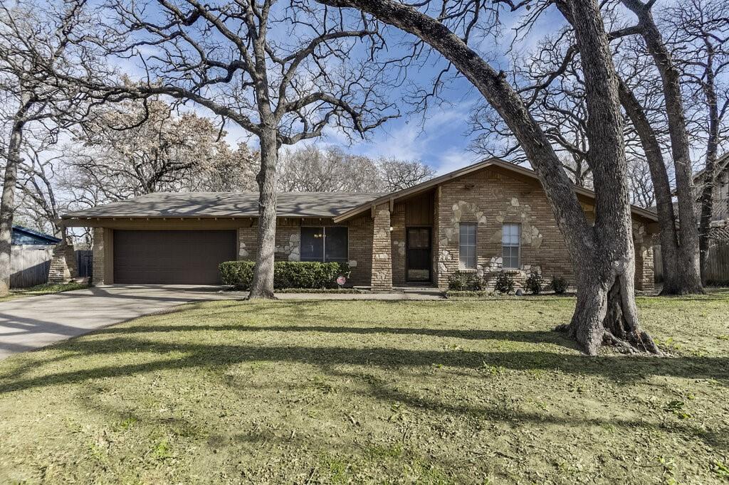807 North Bowen Road Arlington, TX 76012 - Photo 1 of 25 a view of a trees in front of a house