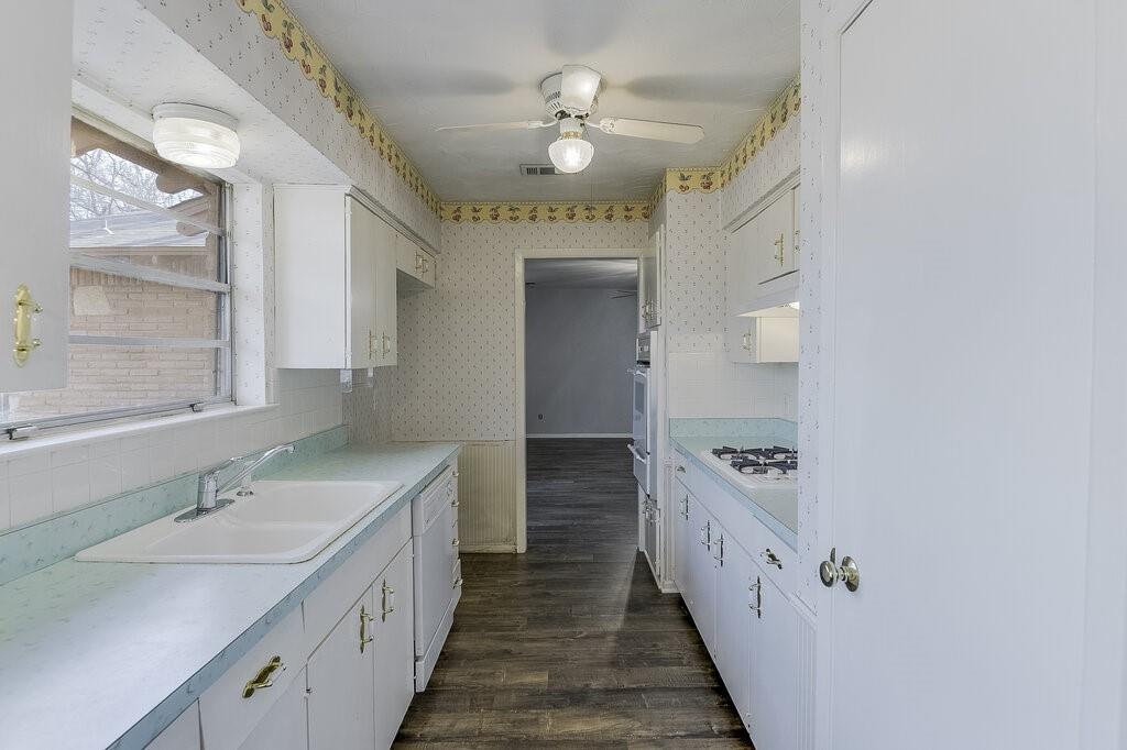 807 North Bowen Road Arlington, TX 76012 - Photo 14 of 25 a bathroom with a double vanity sink and a mirror