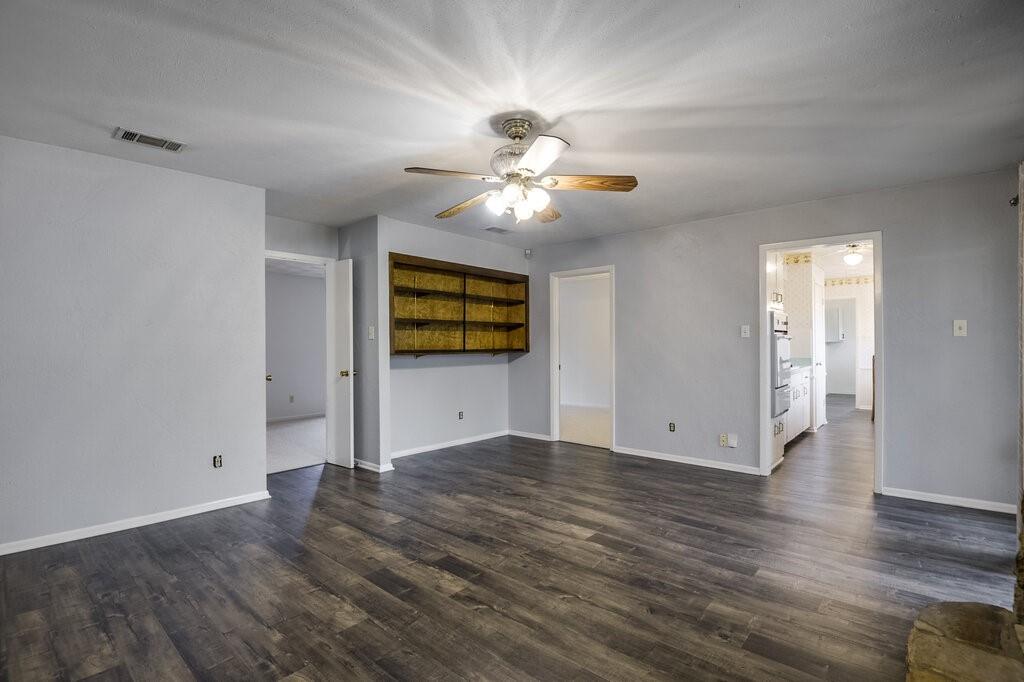 807 North Bowen Road Arlington, TX 76012 - Photo 10 of 25 wooden floor in an empty room with a window