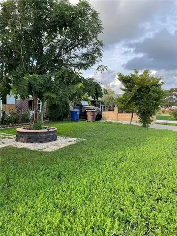 a view of a fountain in front of a house