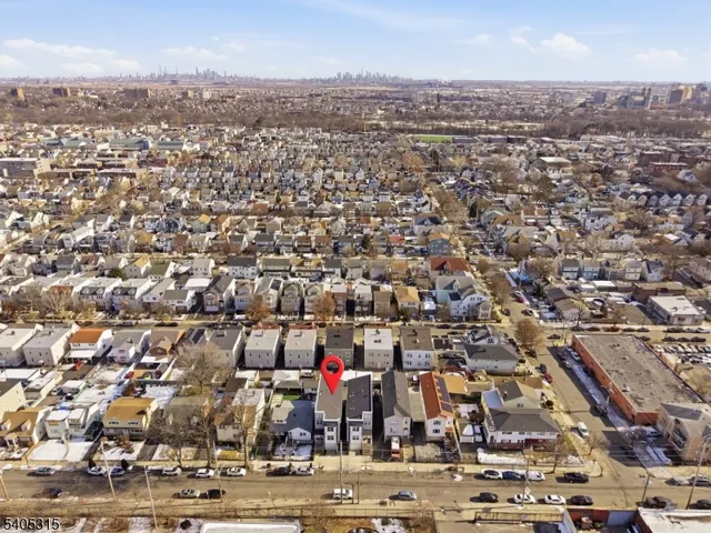 an aerial view of a house with parking space