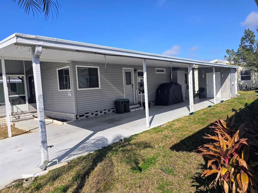 12501 Ulmerton Road, Unit 188 Largo, FL 33774 - Photo 51 of 63 a front view of a house with garden