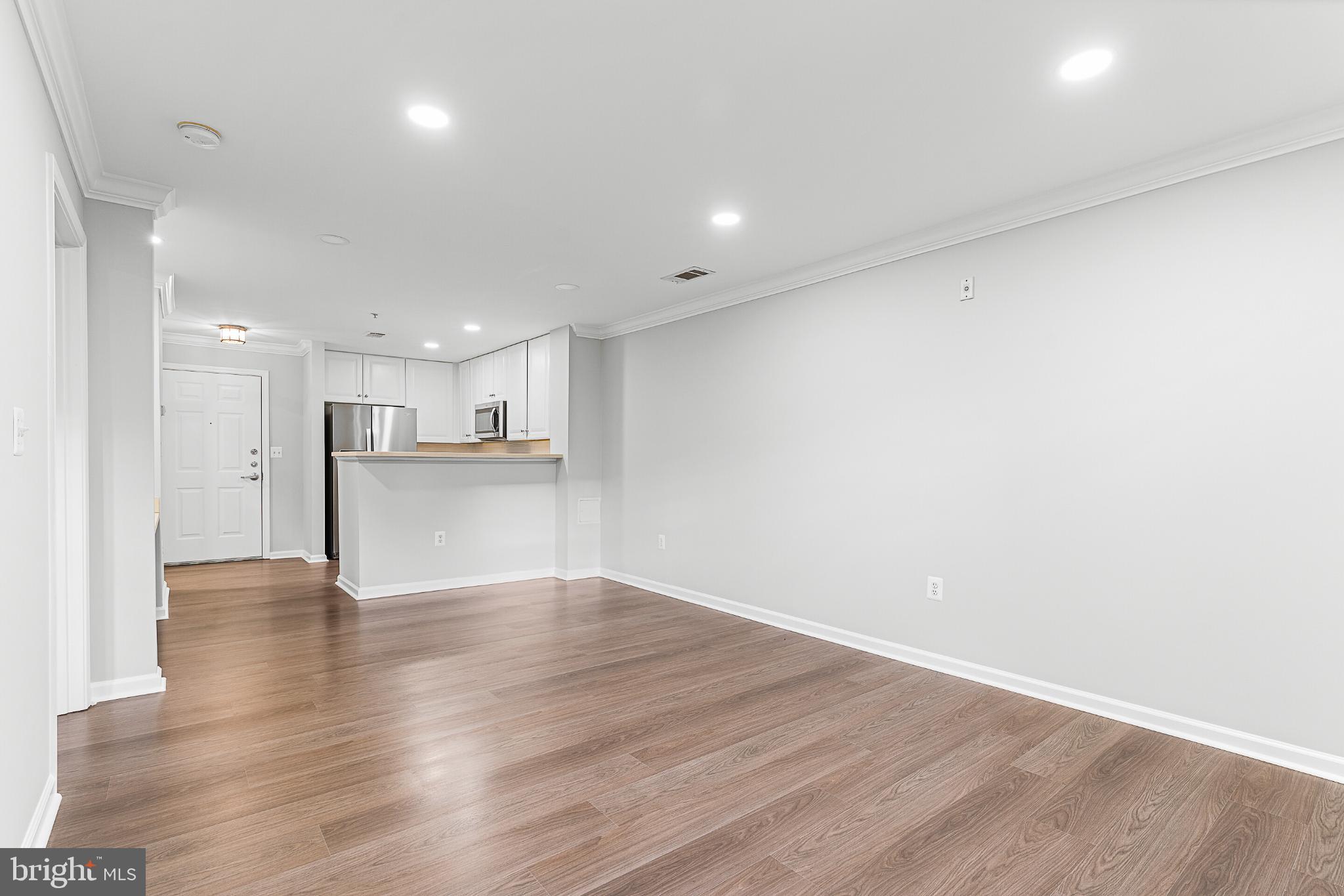 12001 Market Street, Unit T37 Reston, VA 20190 - Photo 10 of 14 Spacious, modern living area with open design.