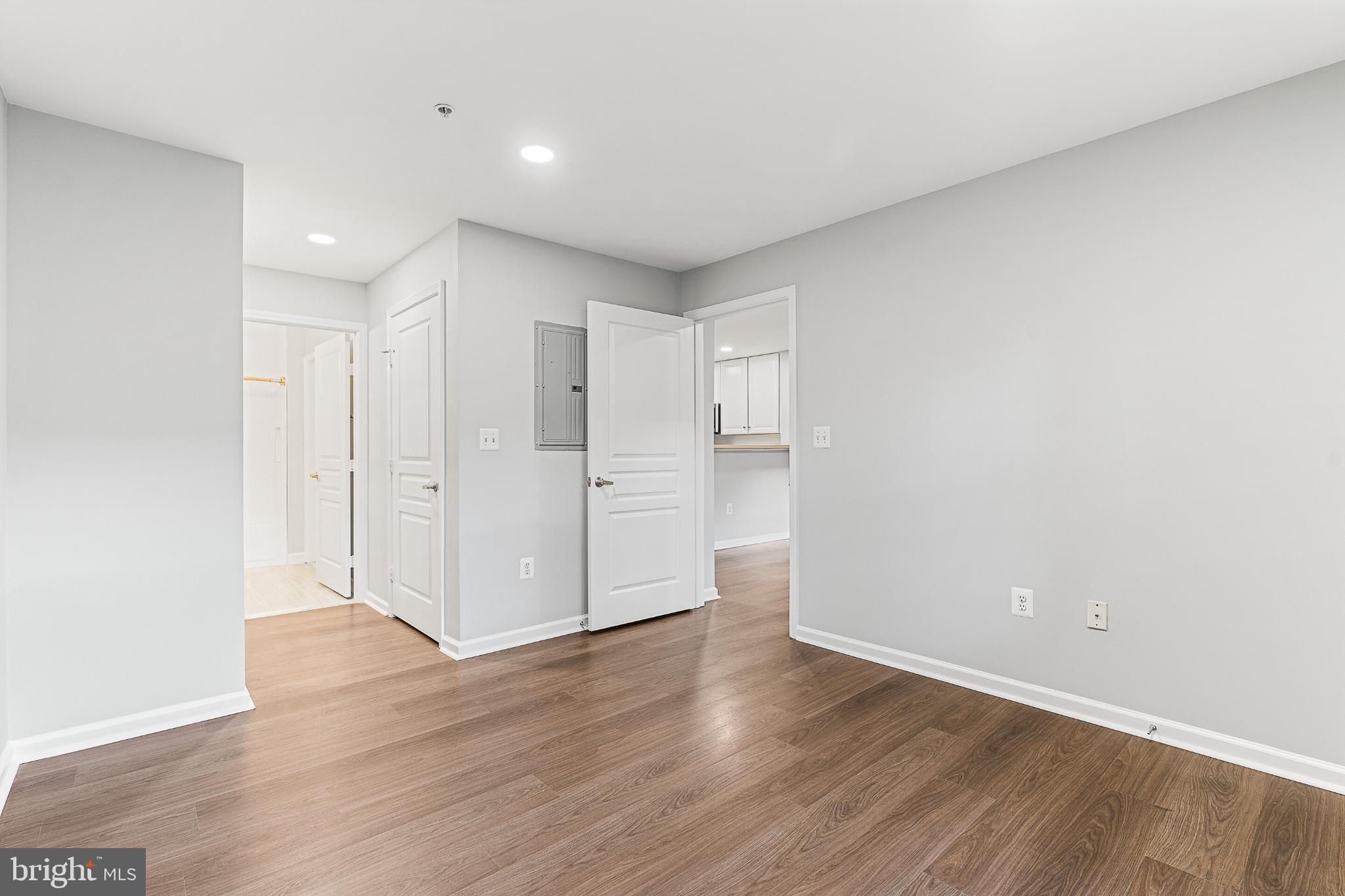 12001 Market Street, Unit T37 Reston, VA 20190 - Photo 12 of 14 Well-lit bedroom with a walk-in closet.