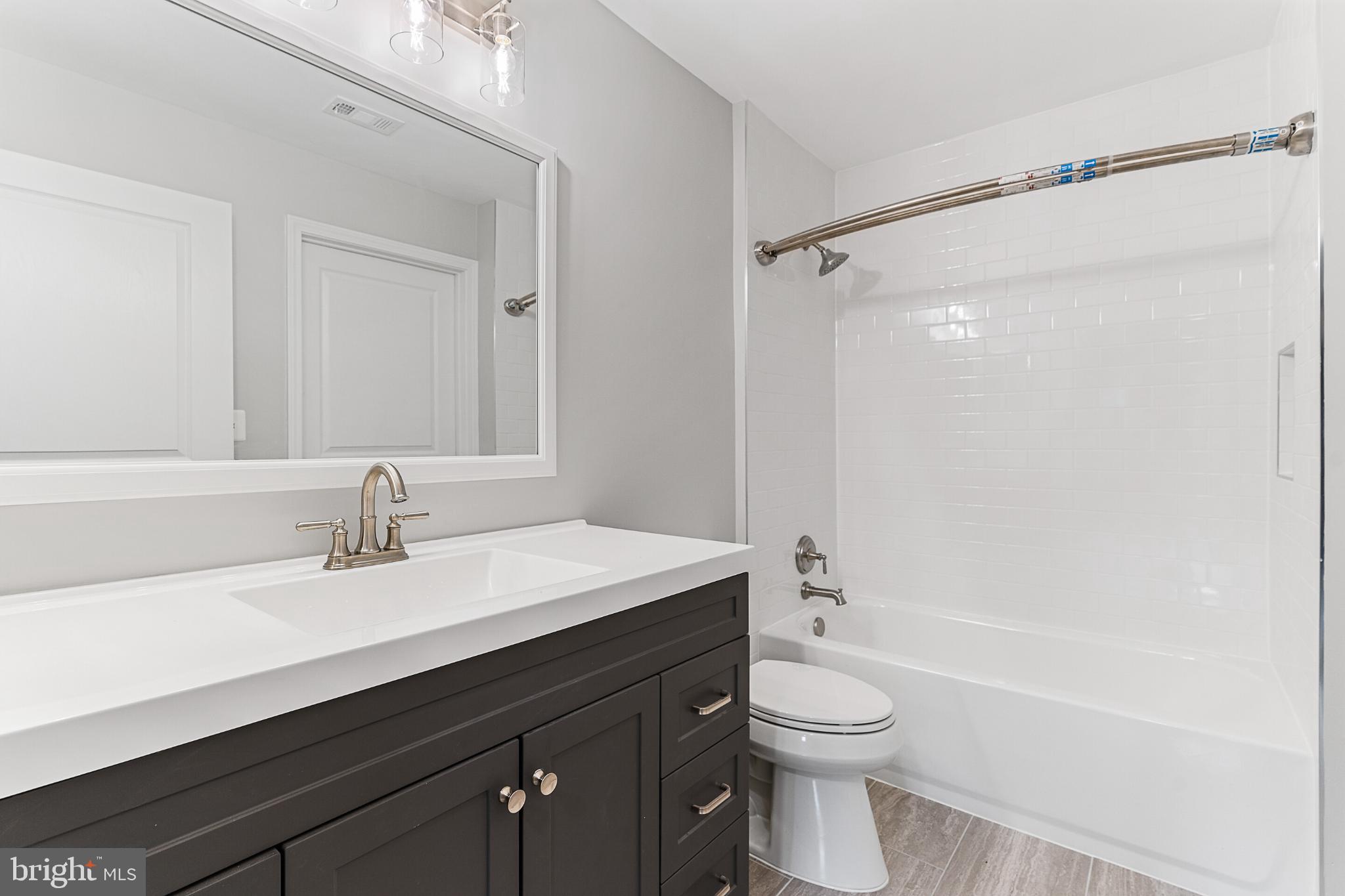 12001 Market Street, Unit T37 Reston, VA 20190 - Photo 13 of 14 Fresh, updated bathroom with sleek finishes.