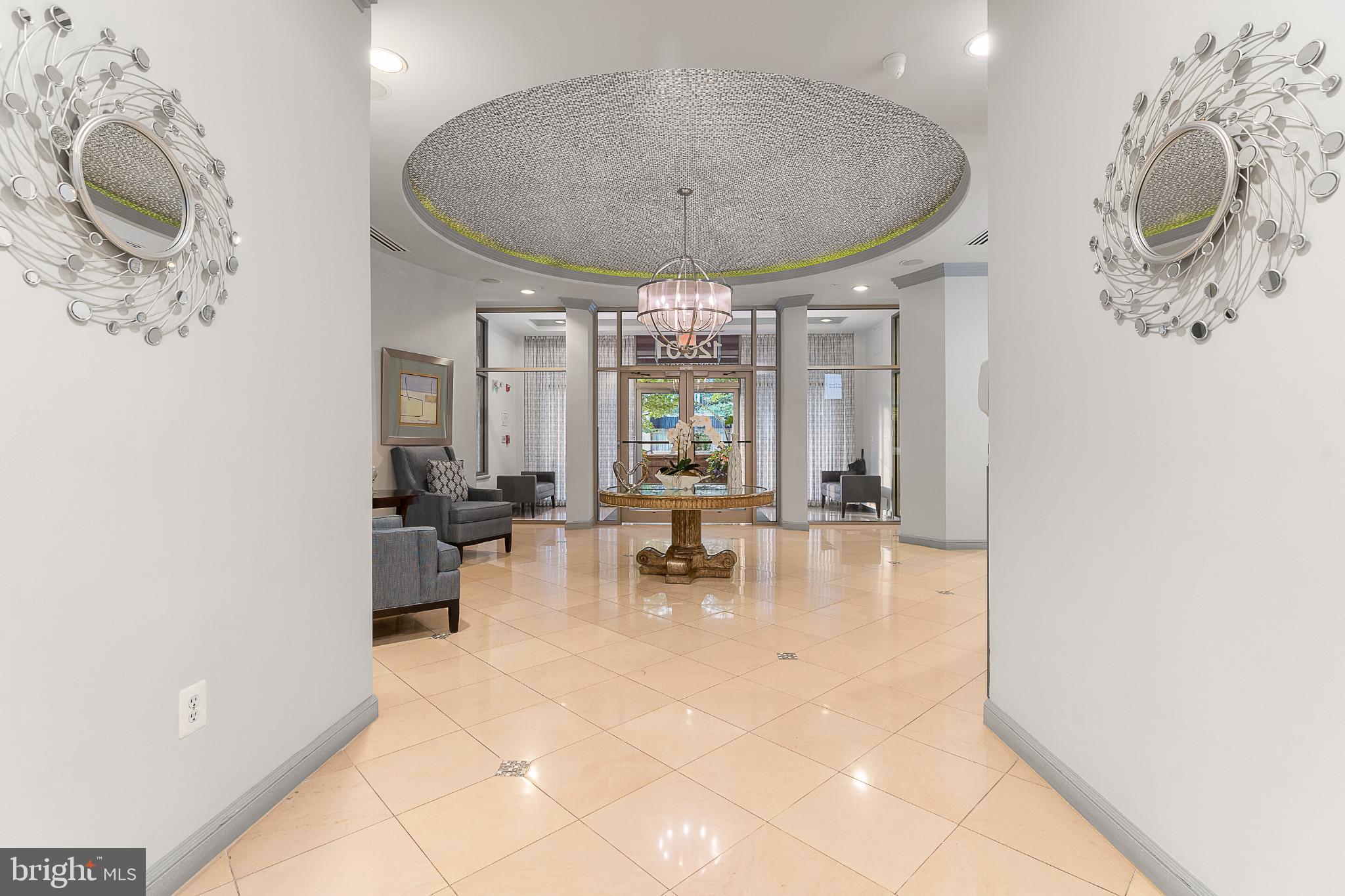 12001 Market Street, Unit T37 Reston, VA 20190 - Photo 4 of 14 Elegant foyer with stunning chandelier.
