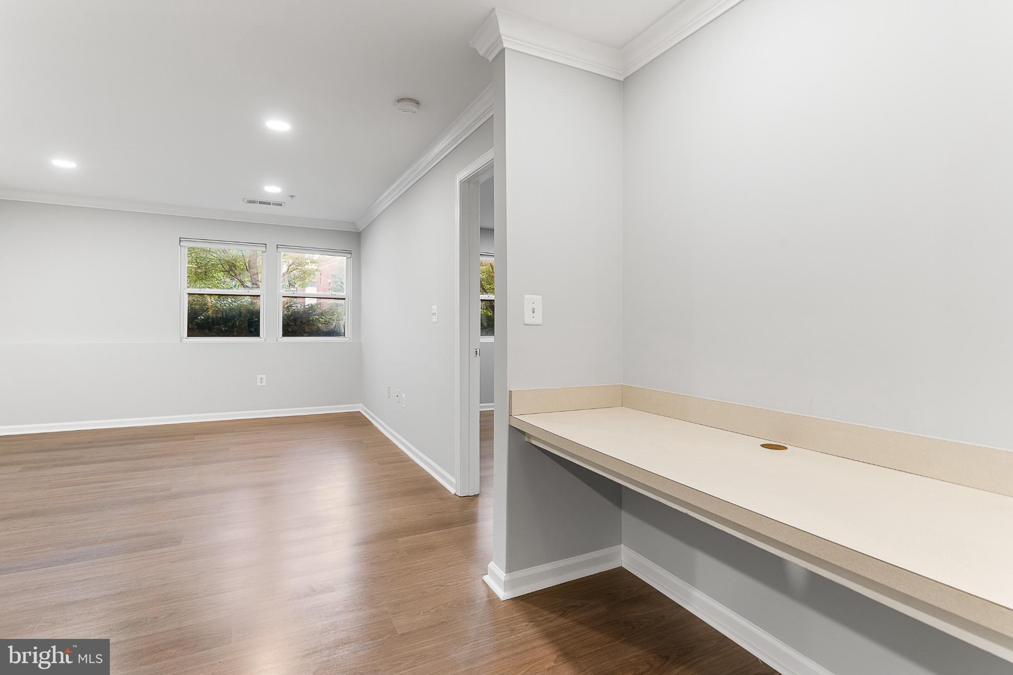 12001 Market Street, Unit T37 Reston, VA 20190 - Photo 8 of 14 Spacious, light-filled room with a built-in desk.