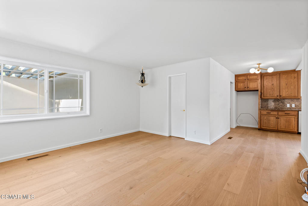 16138 Meadowcrest Road Sherman Oaks, CA 91403 - Photo 20 of 36 a view of a kitchen with a sink and a refrigerator