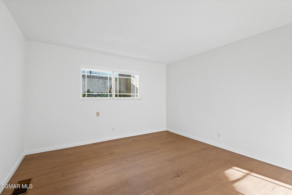 16138 Meadowcrest Road Sherman Oaks, CA 91403 - Photo 23 of 36 a view of a big room with wooden floor and windows