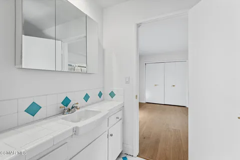 a view of cabinets with wooden floor