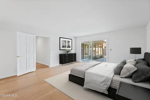 a bedroom with a bed and a couch