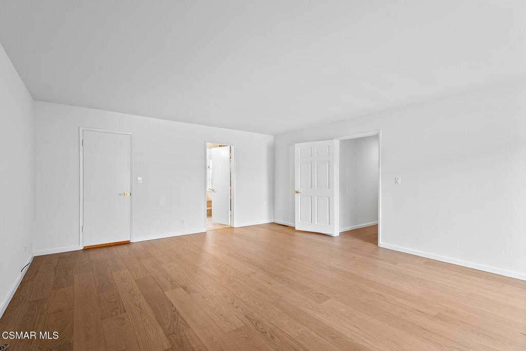 16138 Meadowcrest Road Sherman Oaks, CA 91403 - Photo 31 of 36 a view of an empty room and wooden floor