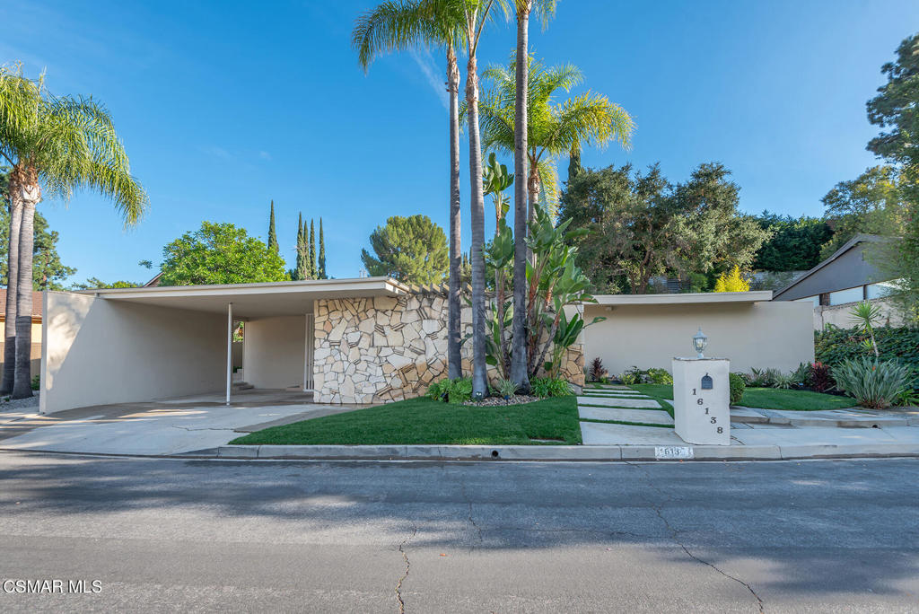 16138 Meadowcrest Road Sherman Oaks, CA 91403 - Photo 36 of 36 front view of a house with a street