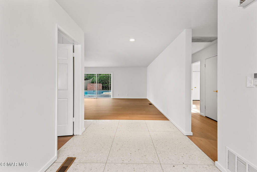 16138 Meadowcrest Road Sherman Oaks, CA 91403 - Photo 5 of 36 a view of an entryway with wooden floor